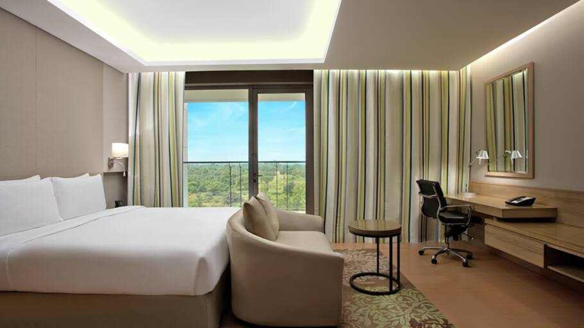 Comfortable hotel room at the DoubleTree Suites by Hilton Bangalore.