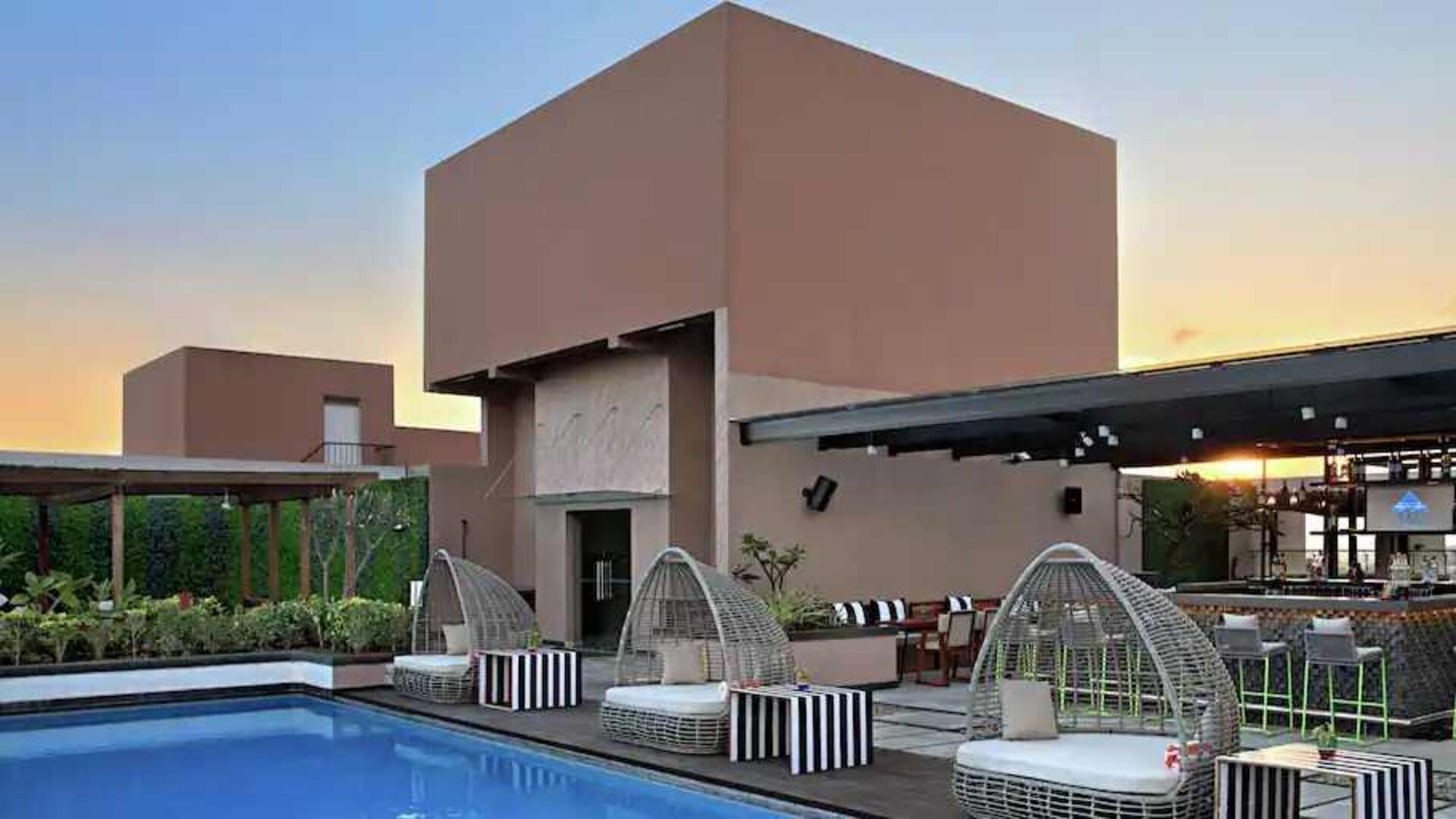 Relaxing outdoor pool at the DoubleTree Suites by Hilton Bangalore.