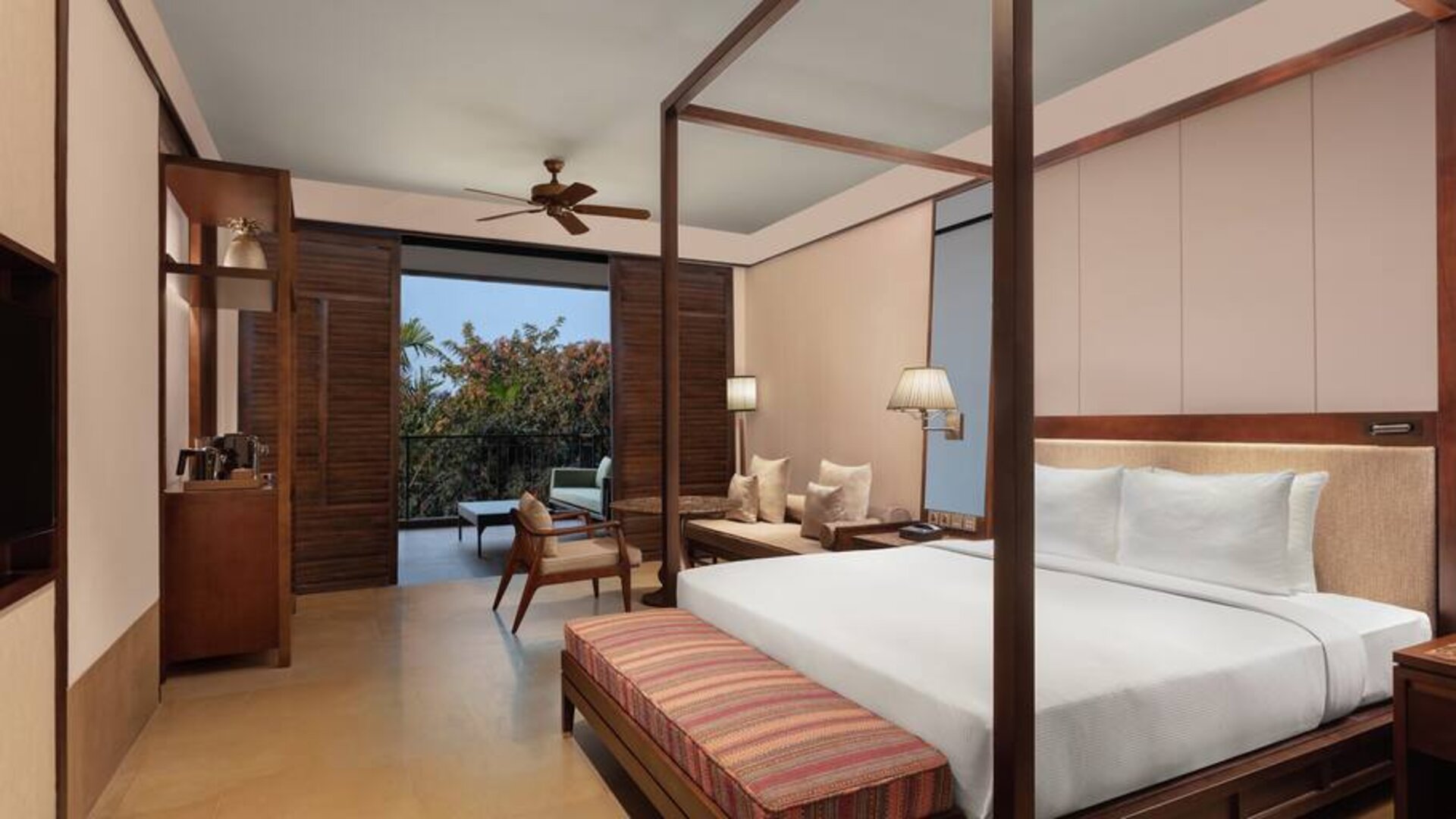 King bedroom with desk at the Hilton Goa Resort.