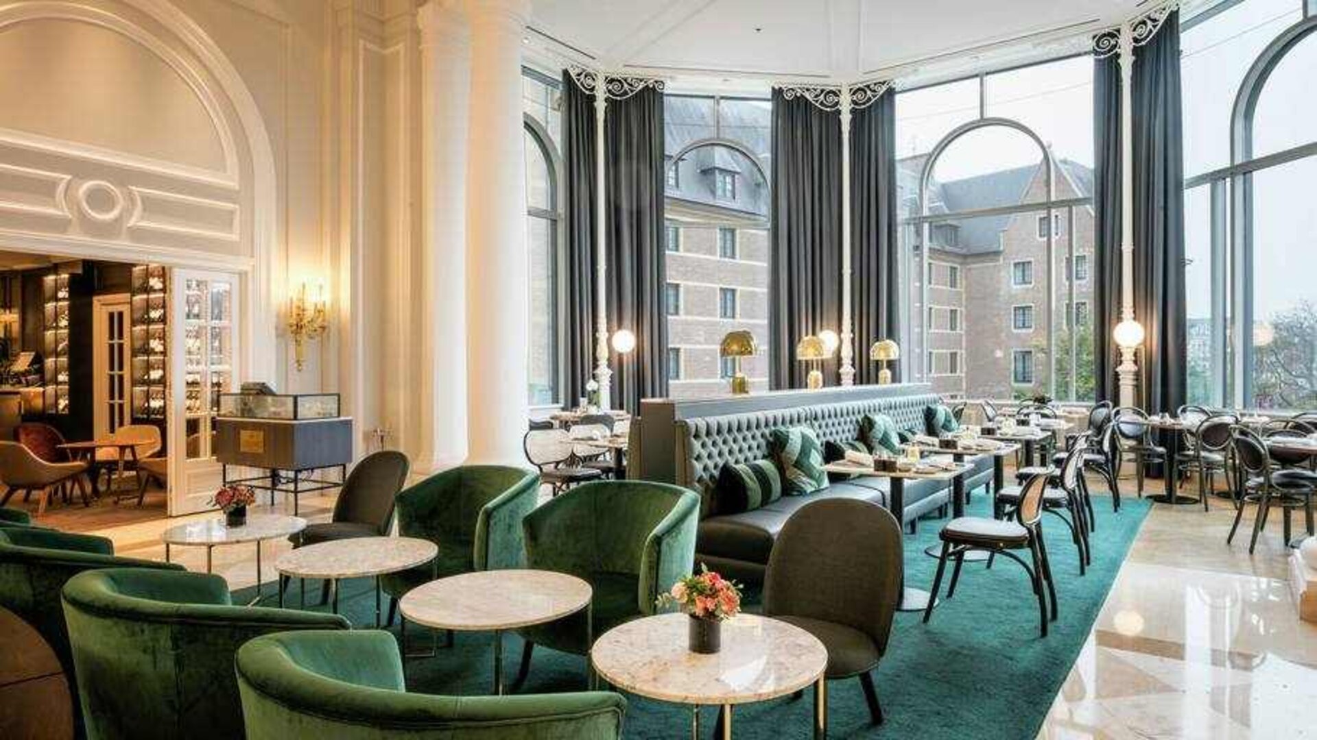 Seating area perfect as workspace at the Hilton Brussels Grand Place .