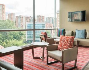 Bright hotel workspace at the Hampton by Hilton Medellin Antioquia.