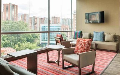 Bright hotel workspace at the Hampton by Hilton Medellin Antioquia.