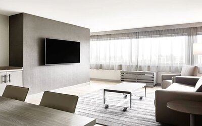 Living room in a hotel suite at the AC Hotel By Marriott Pleasanton.