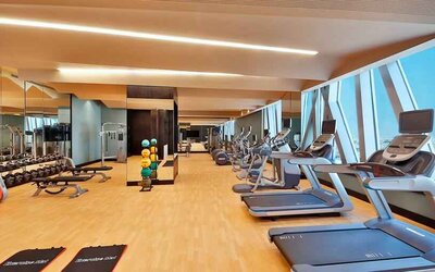 Fitness center at the AlRayyan Hotel Doha, Curio Collection by Hilton.
