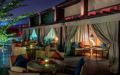 Outdoor patio at the AlRayyan Hotel Doha, Curio Collection by Hilton.