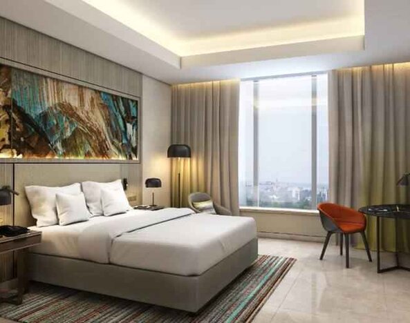 King bedroom with working station at the Hilton Kinshasa.