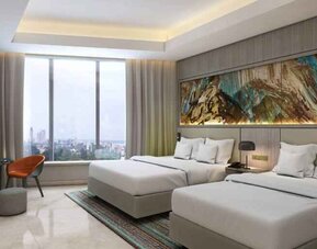 Twin room with desk at the Hilton Kinshasa.