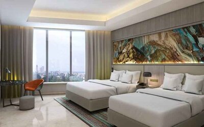 Twin room with desk at the Hilton Kinshasa.