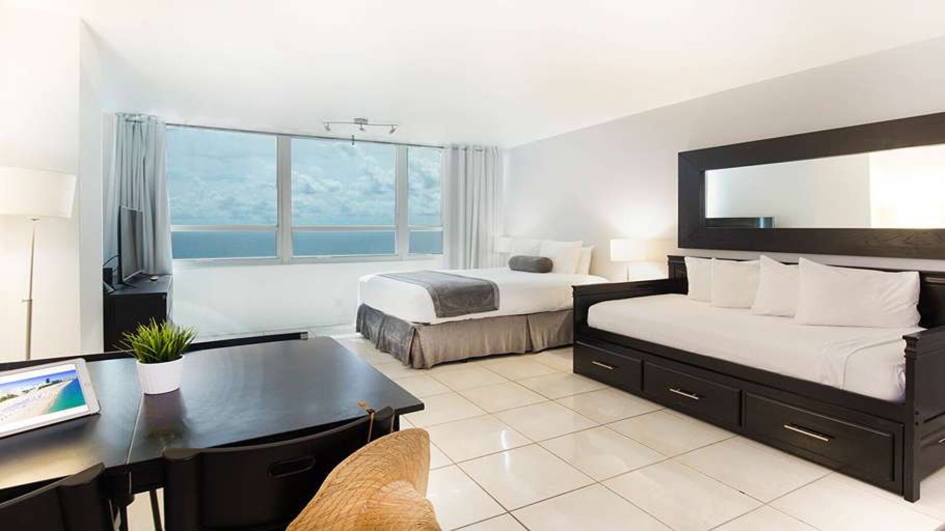 Queen room with workstation at New Point Miami.