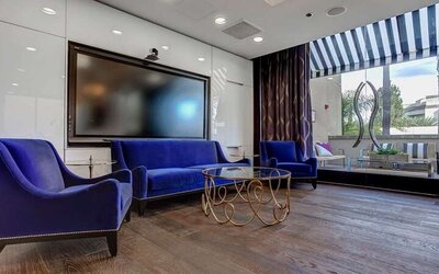 Hotel workspace with TV screen at Avenue Of The Arts Hotel.