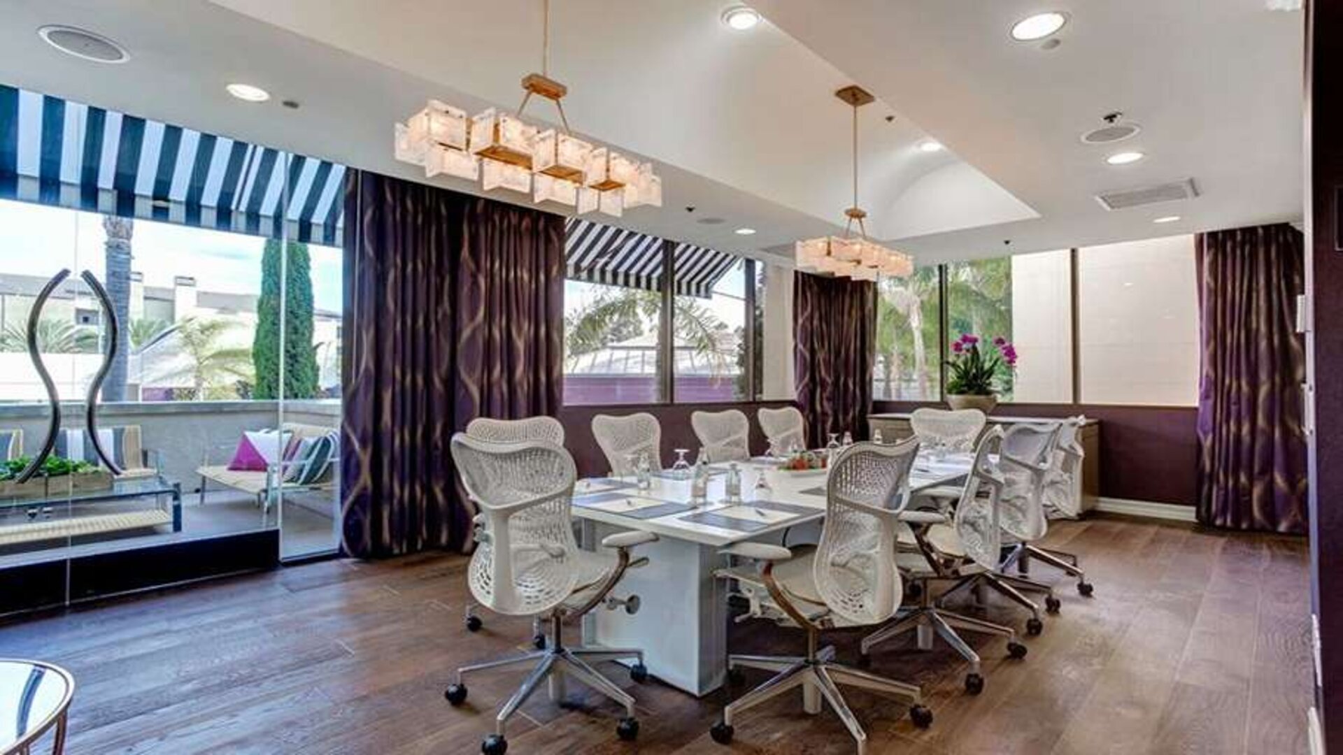 Bright meeting room with windows at Avenue Of The Arts Hotel.