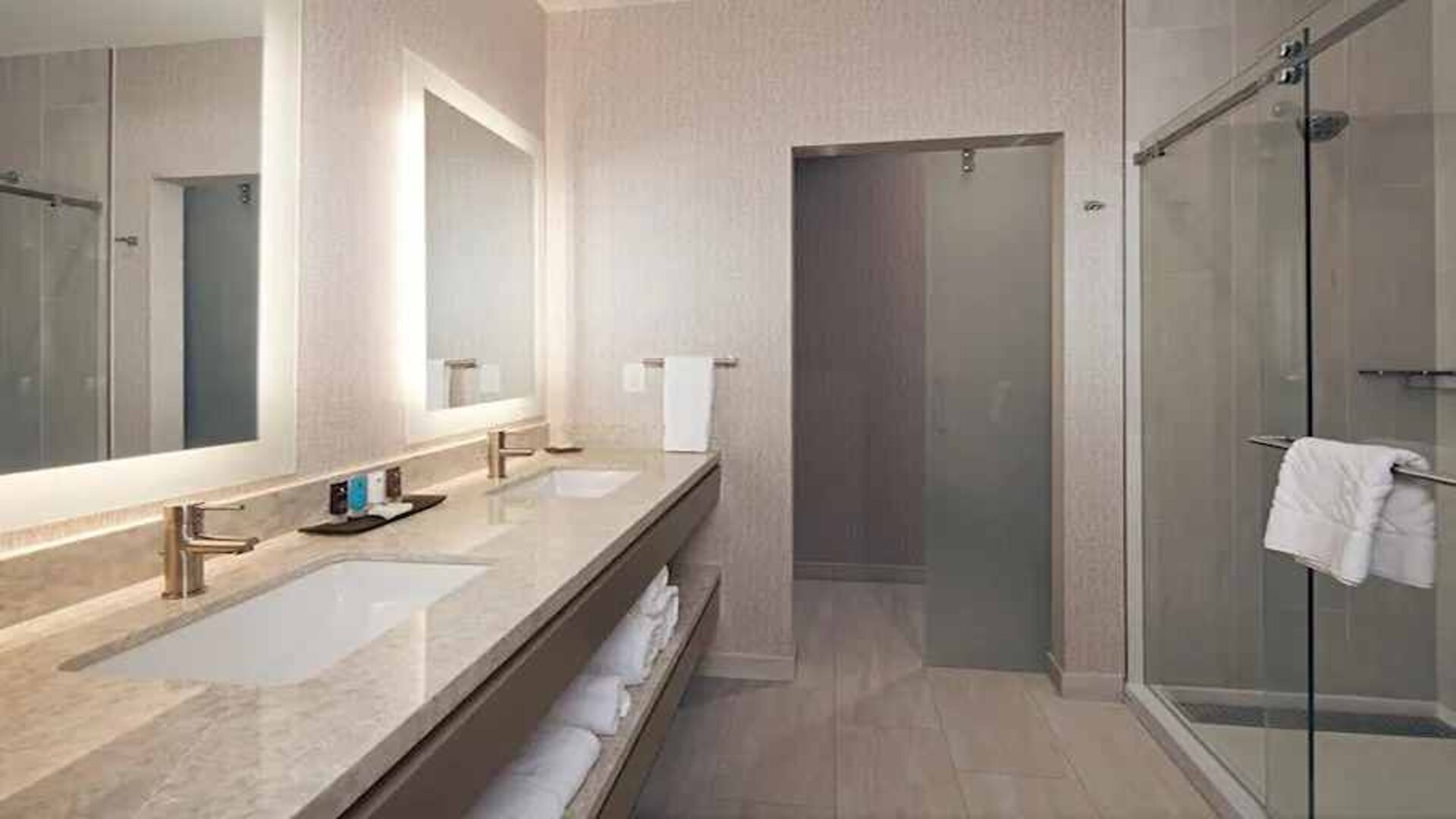 Guest bathroom with shower at H Hotel Los Angeles, Curio Collection By Hilton.
