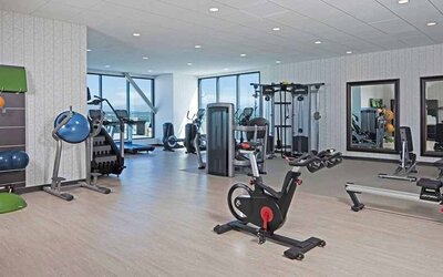 Fitness center available at H Hotel Los Angeles, Curio Collection By Hilton.
