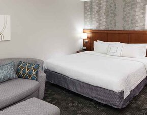 Day use room with sofa at Courtyard Miami Dolphin Mall.