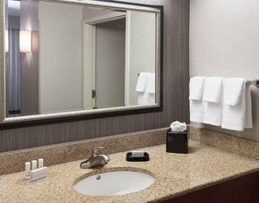 Guest bathroom with shower at Courtyard Miami Dolphin Mall.