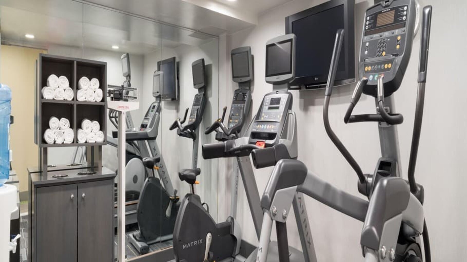 Well equipped fitness center with treadmills at Holiday Inn Wall Street.