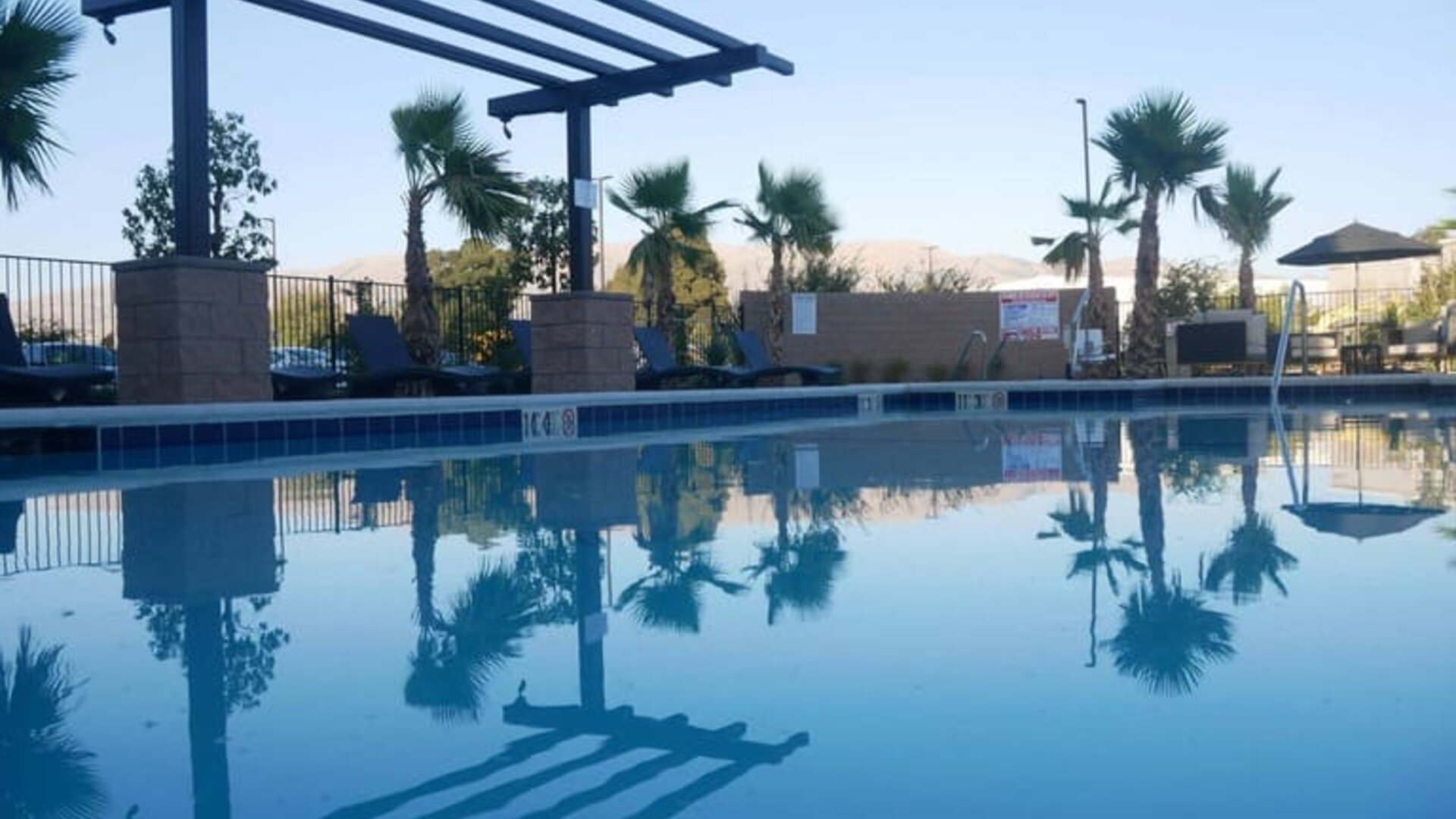 Refreshing outdoor pool at Holiday Inn & Suites Silicon Valley - Milpitas.