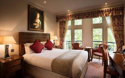 The Royal Horseguards Hotel’s garden view double room, with large windows for a verdant view.