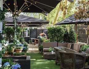 The Terrace, a green space outside with seating for social events and casual dining.