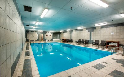 The hotel’s indoor pool has chairs and towels close at hand for swimmers.