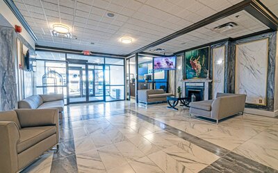 The Quality Inn Halifax Airport’s lobby has numerous comfy sofas, plus a widescreen TV and art on the walls.