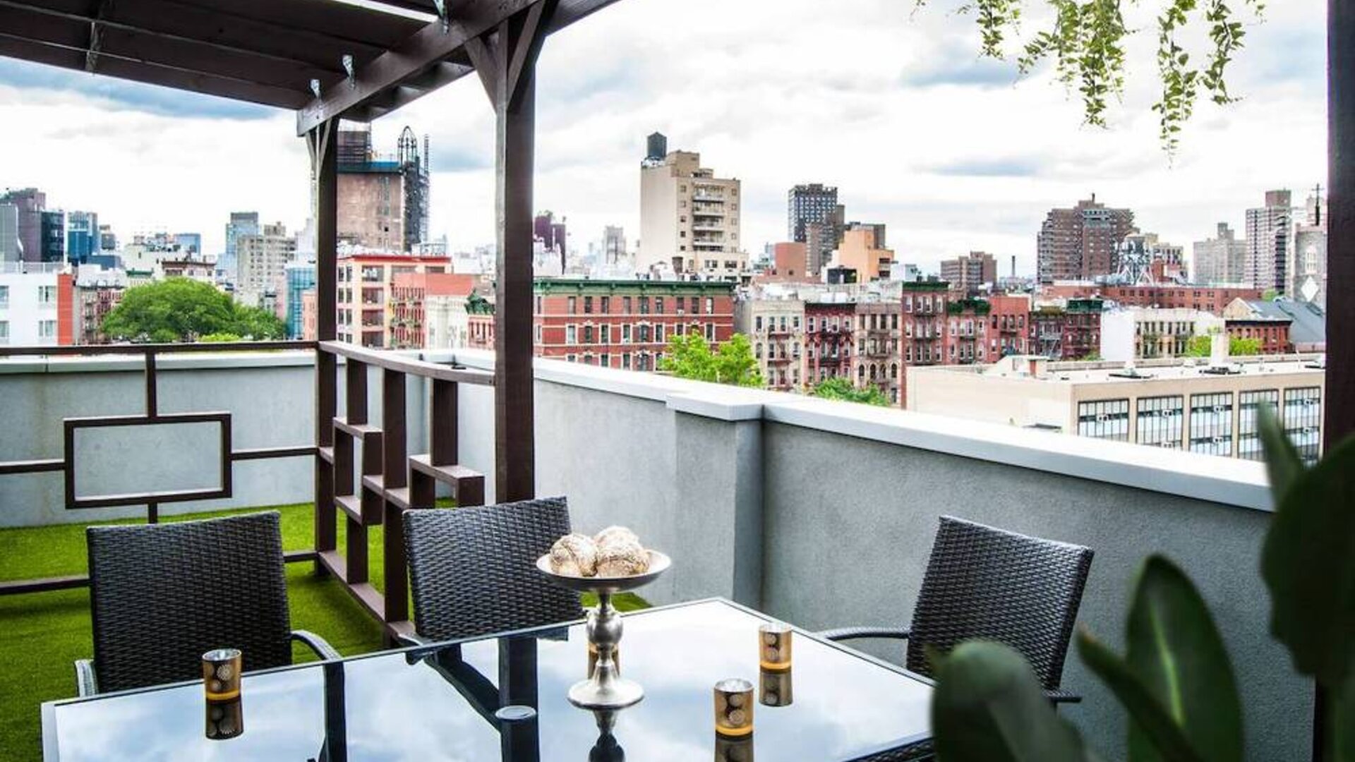 Outdoor terrace with table and chairs for relaxing/socializing.