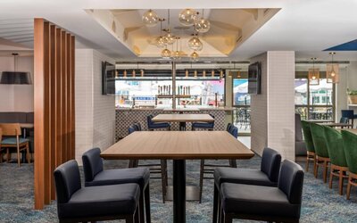 The on-site restaurant has both indoor and outdoor tables, and a bar.