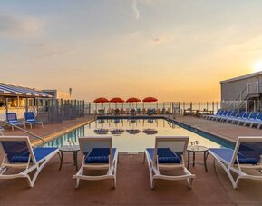 Stunning outdoor pool at sunset at Sea Crest Beach Hotel.