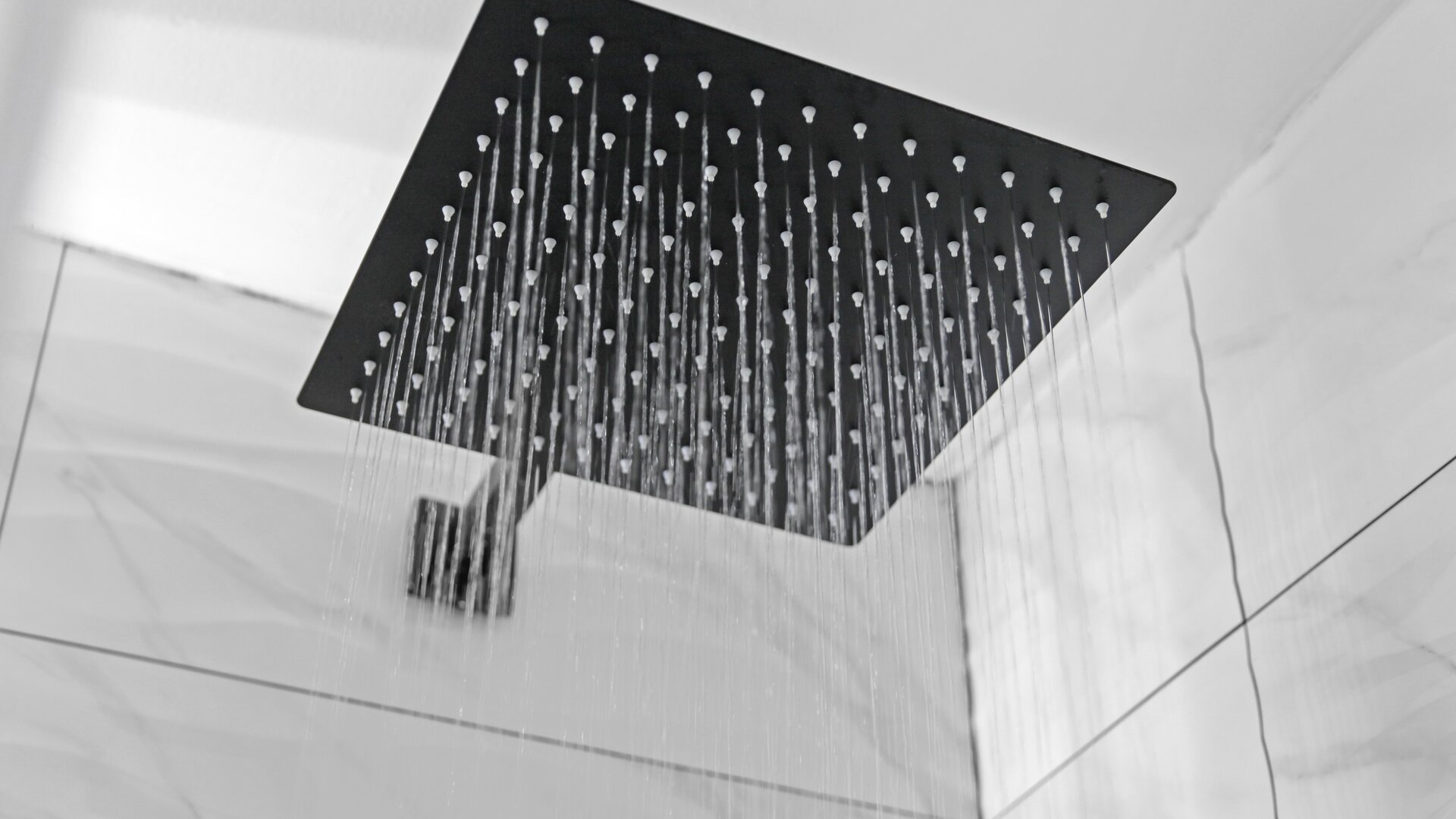 Guest bathroom with shower at Hotel Opus Bronx.