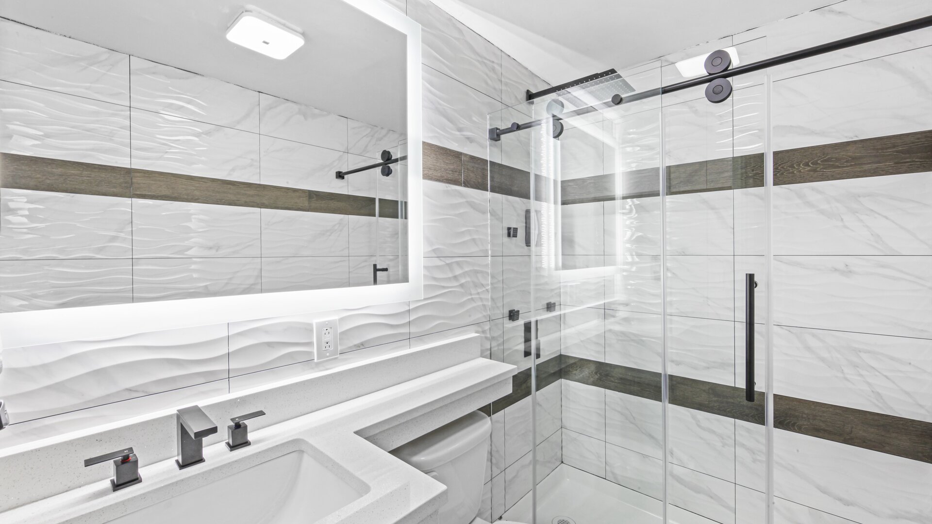 Guest bathroom with shower at Hotel Opus Bronx.