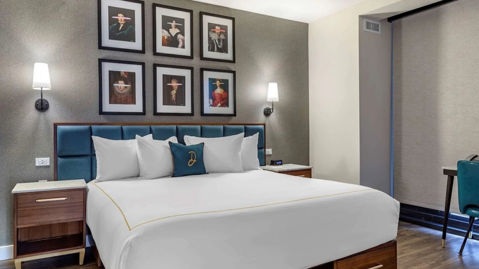 Double bed guest room in The Draper, Ascend Hotel Collection, with art on the wall above the bed, and bedside tables.