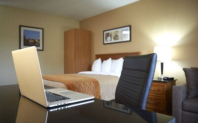 An in-room workspace desk and chair at Comfort Inn Fredericton.