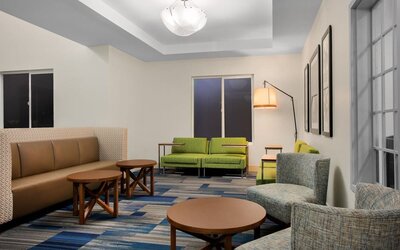 Comfortable lobby and coworking space at Holiday Inn Express & Suites Ontario.