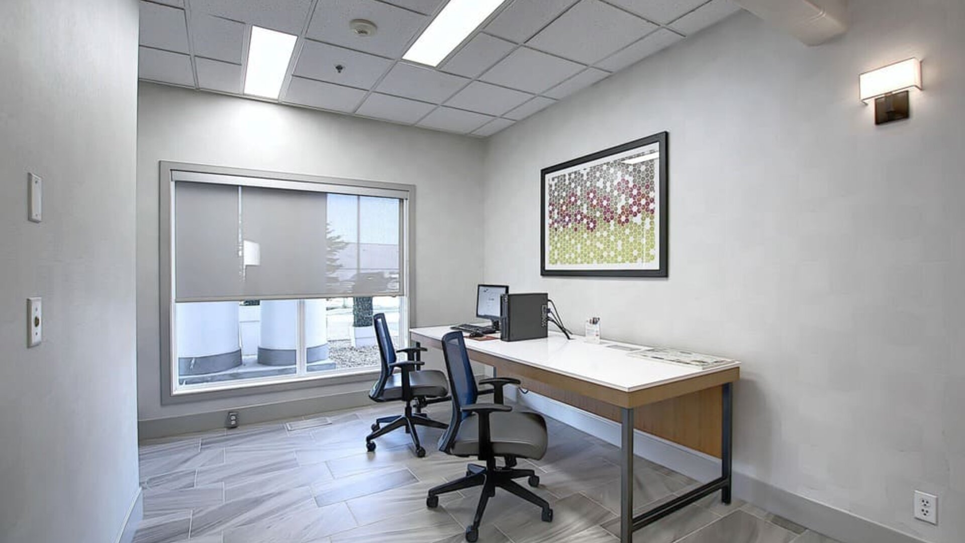 Dedicated business center with PC, internet, printer, and work space at Holiday Inn Express & Suites Airport-Calgary.