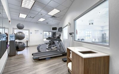 Well equipped fitness center at Holiday Inn Express & Suites Airport-Calgary.