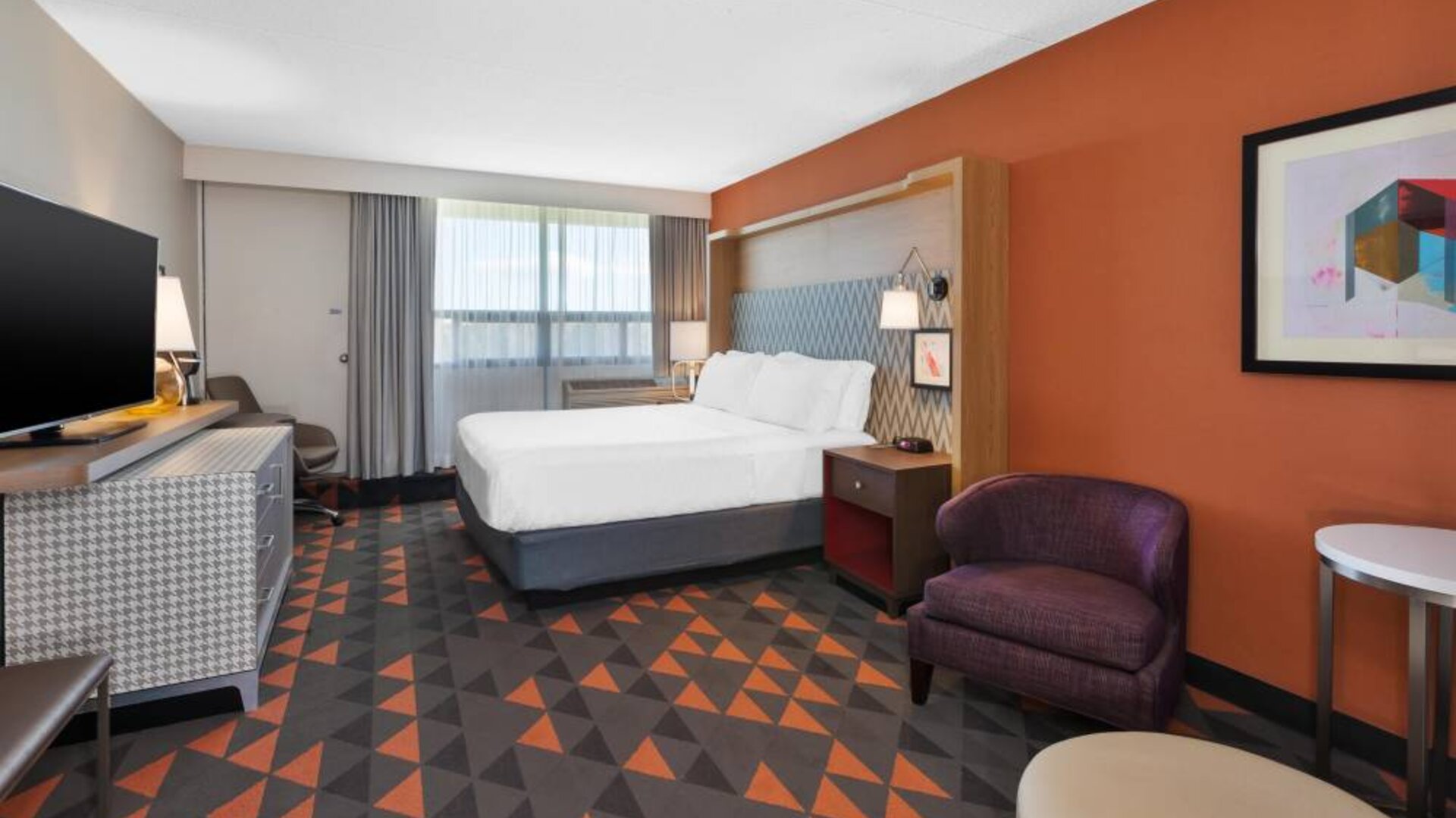 Holiday Inn St. John’s Conference Centre guest room, with double bed, window, and large TV.