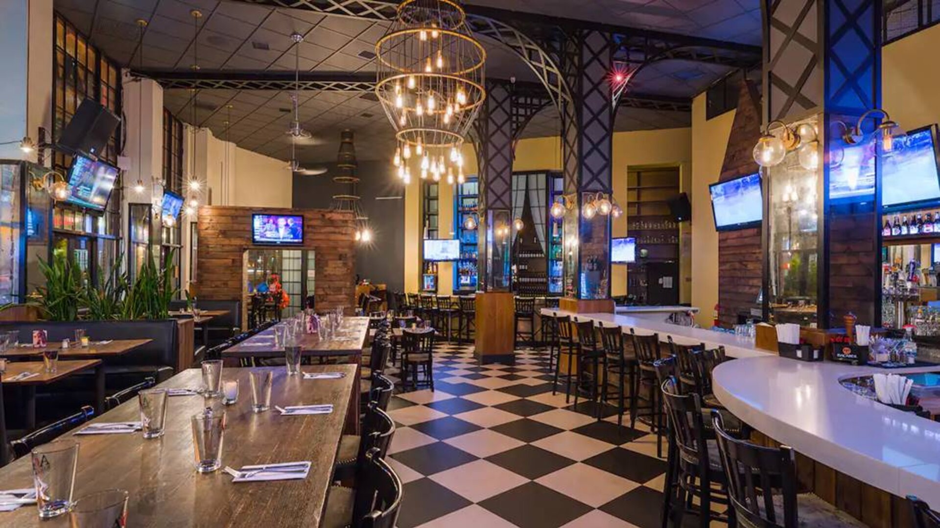 Dining on-site at the AOA Bar & Grill, with seating at both tables and the bar.