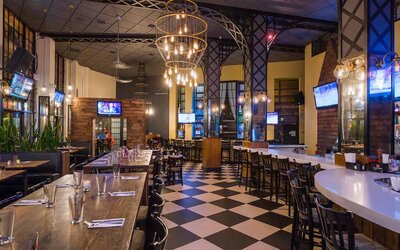 Dining on-site at the AOA Bar & Grill, with seating at both tables and the bar.