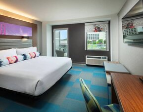 Day use room with balcony and work desk at Aloft SFO.