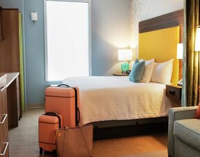 King bedroom with work station at Home2 Suites By Hilton Dallas Medical District Lovefield.