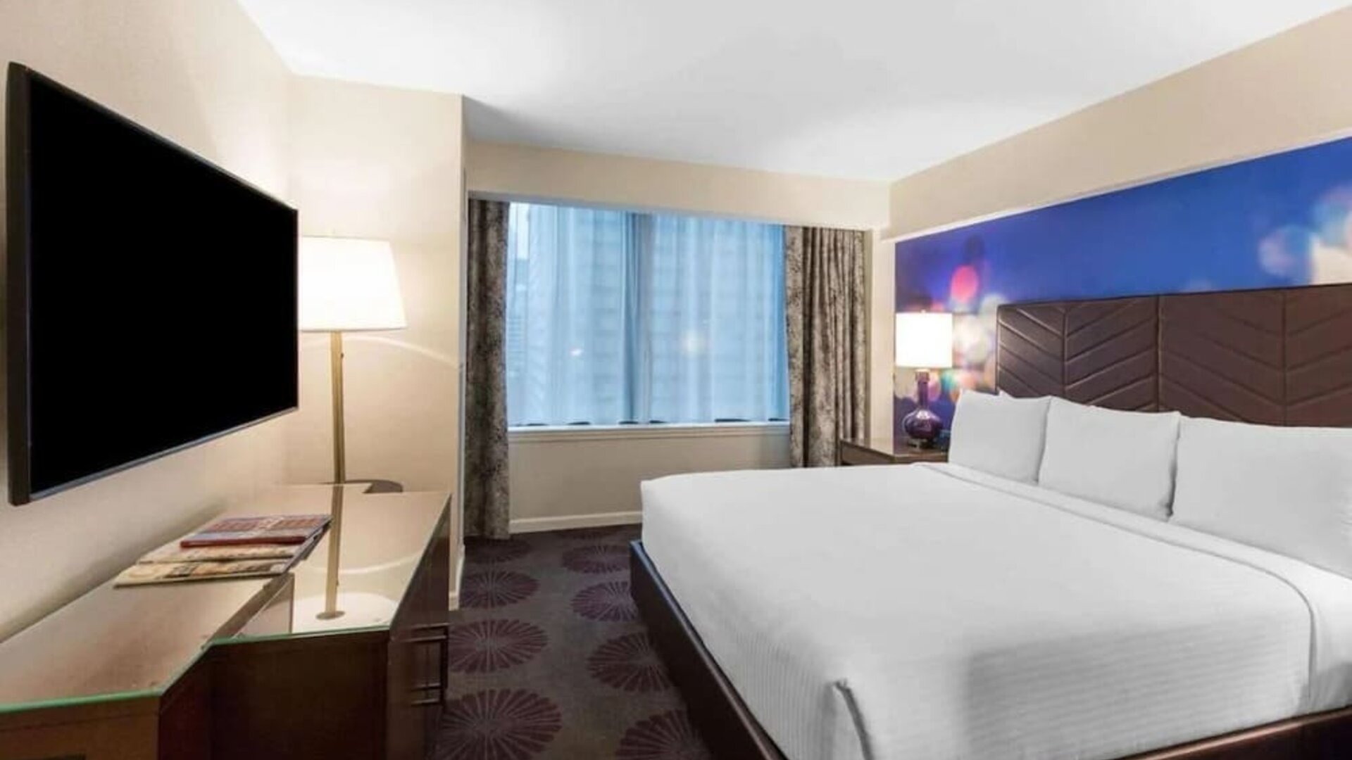 Comfortable delux king room with TV at The Chicago Hotel Collection - Magnificent Mile.