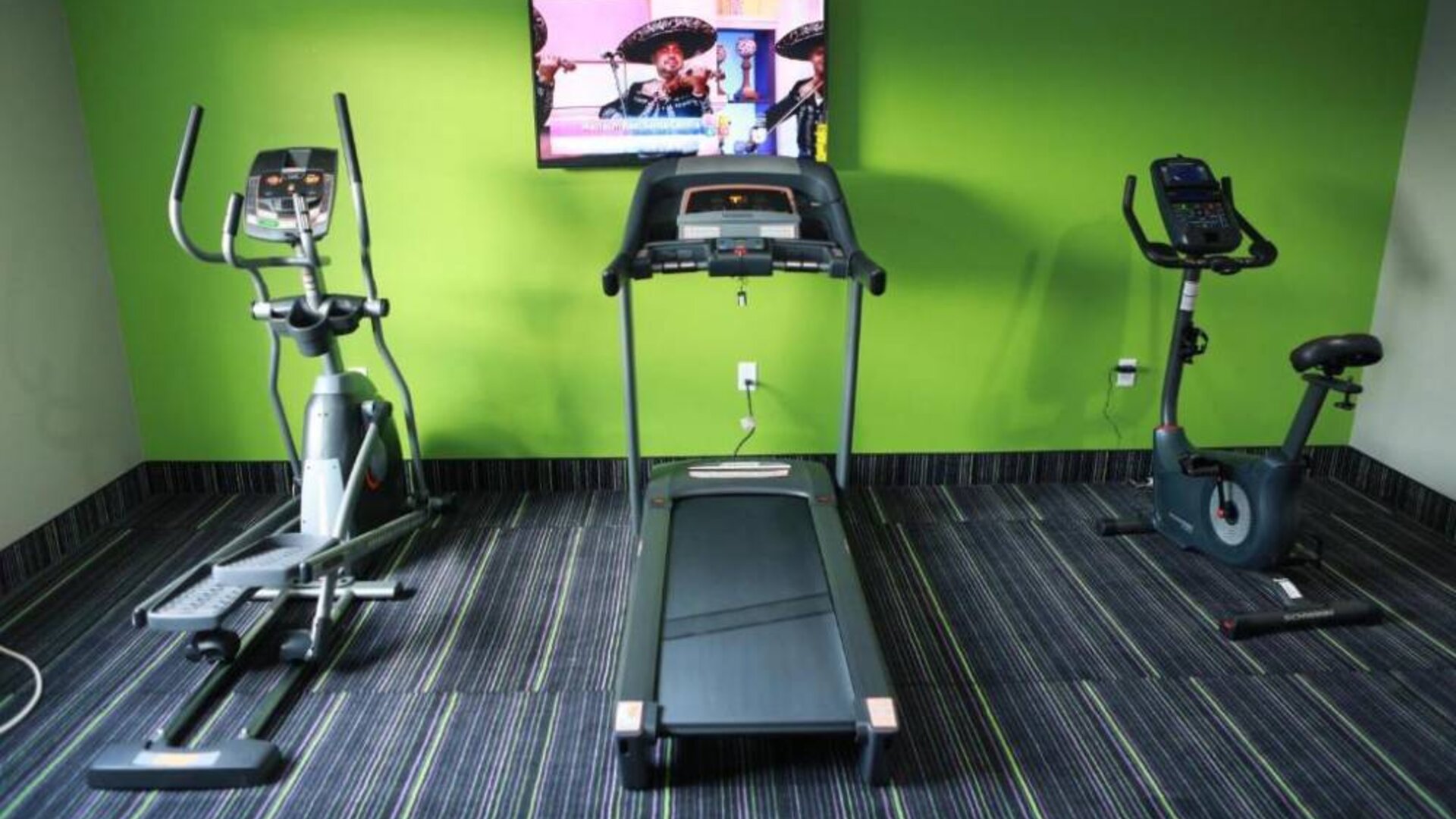 Fitness center available at Home Inn & Suites.