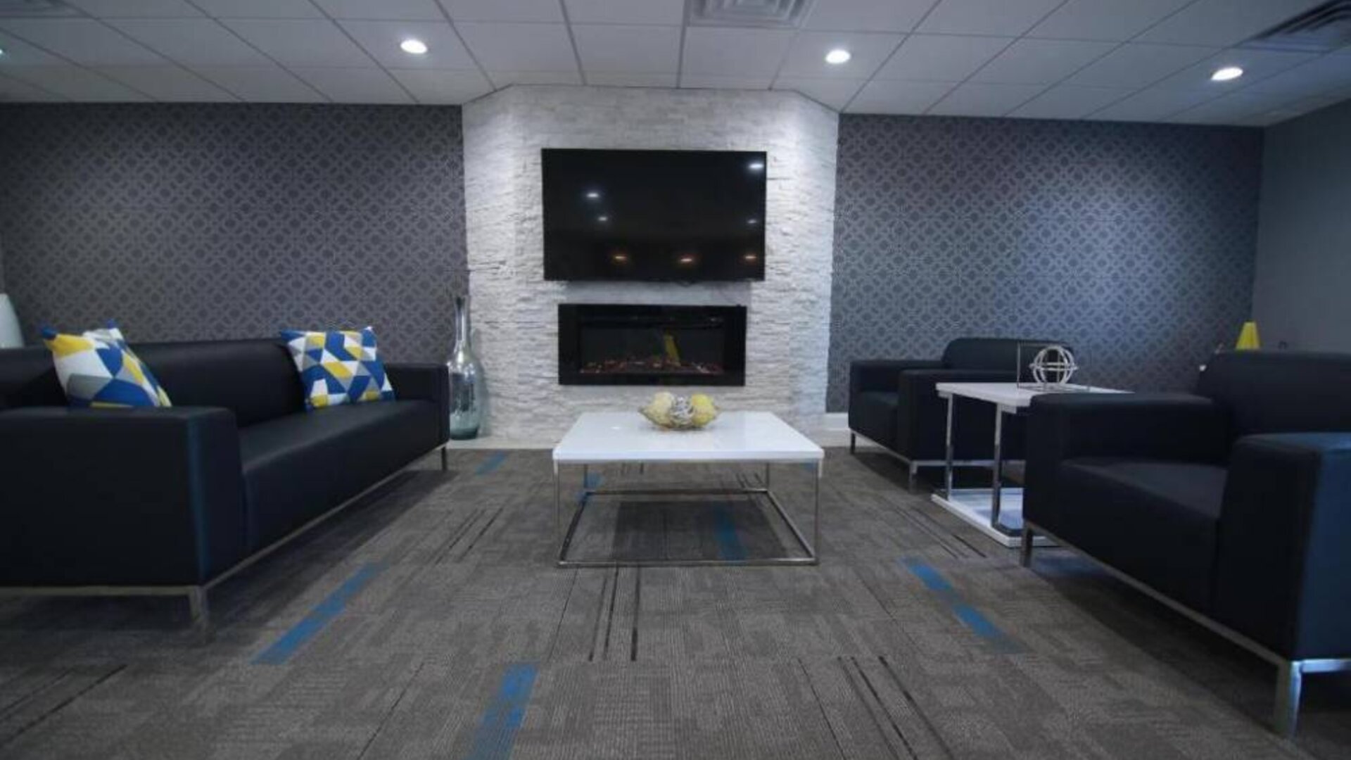 Lobby and coworking lounge at Home Inn & Suites.