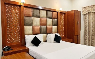 Comfortable delux king room at The Grand Hotel Multan.