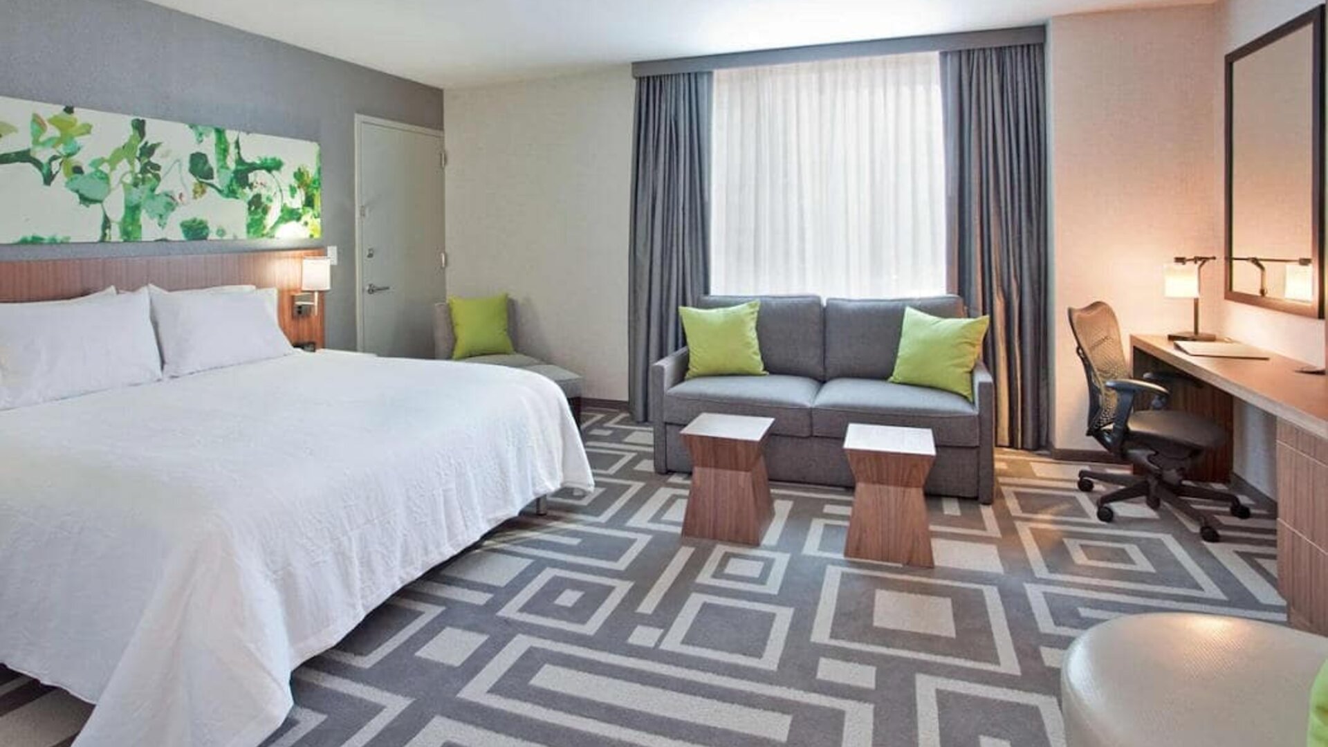 Guest room in Hilton Garden Inn New York Central Park South Mid-town West, with workspace desk and chair.