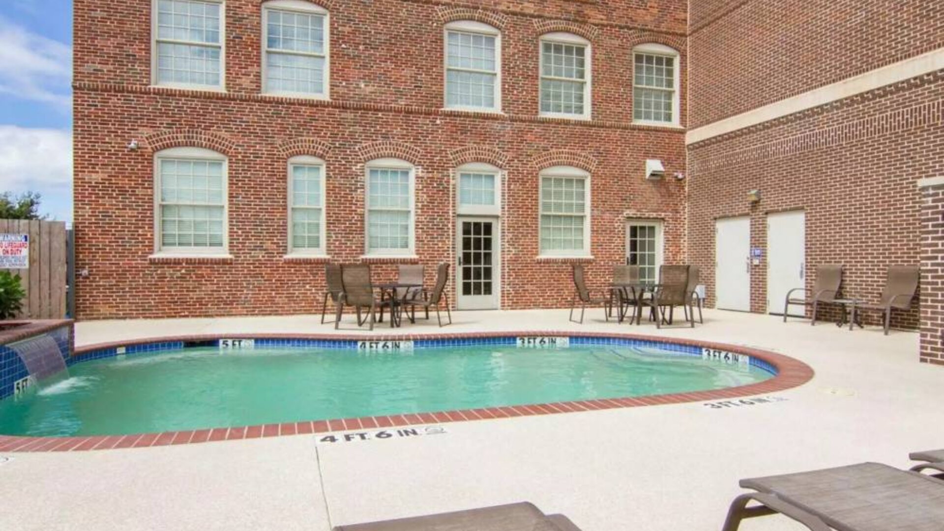 Refreshing outdoor pool at Liberty Hotel Cleburne, An Ascend Hotel Collection Member.