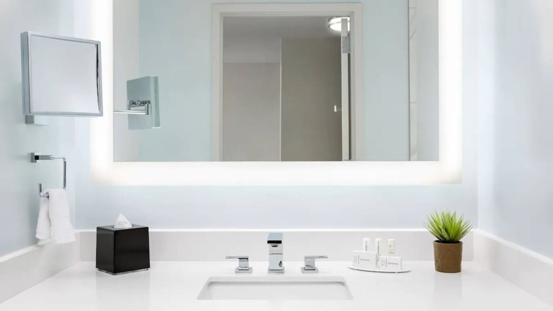 Well-lit guest bathroom with shower at Courtyard Boston Cambridge.