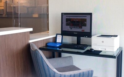 Dedicated business center with PC, internet, and printer at Holiday Inn Express & Suites Boston-Cambridge.