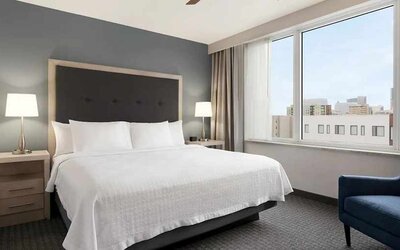 Spacious king suite with work area and TV at Homewood Suites by Hilton University City.