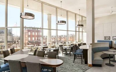 Comfortable lounge and coworking space with lots of natural light at Homewood Suites by Hilton University City.